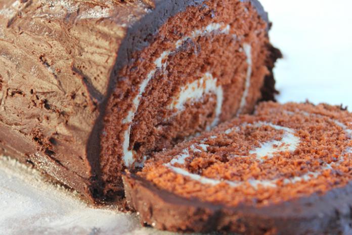 https://www.grocery.coop/sites/default/files/styles/amp_metadata_content_image_min_696px_wide/public/wp-content/uploads/2015/11/Yule-Log-Cake_0.jpg?itok=PJIrzsRZ