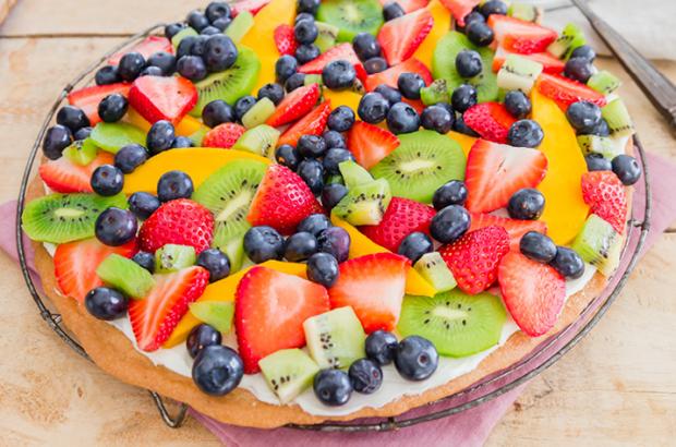 Shortbread fruit pizza topped with colorful sliced fruit