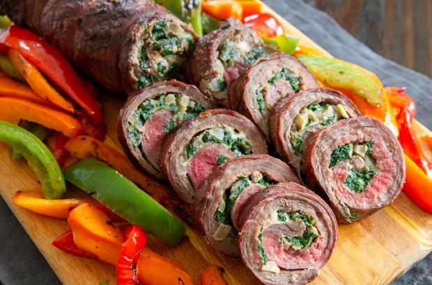 Rolled grilled flank steak with spinach and blue cheese