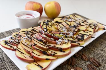 Apple slices drizzled with a chocolate-raspberry syrup 