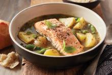Bowl of Roasted Salmon and Vegetables in Pesto Broth