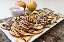 Apple slices drizzled with a chocolate-raspberry syrup 