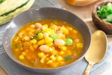 Bowl of corn, squash and bean soup - Three Sisters Soup